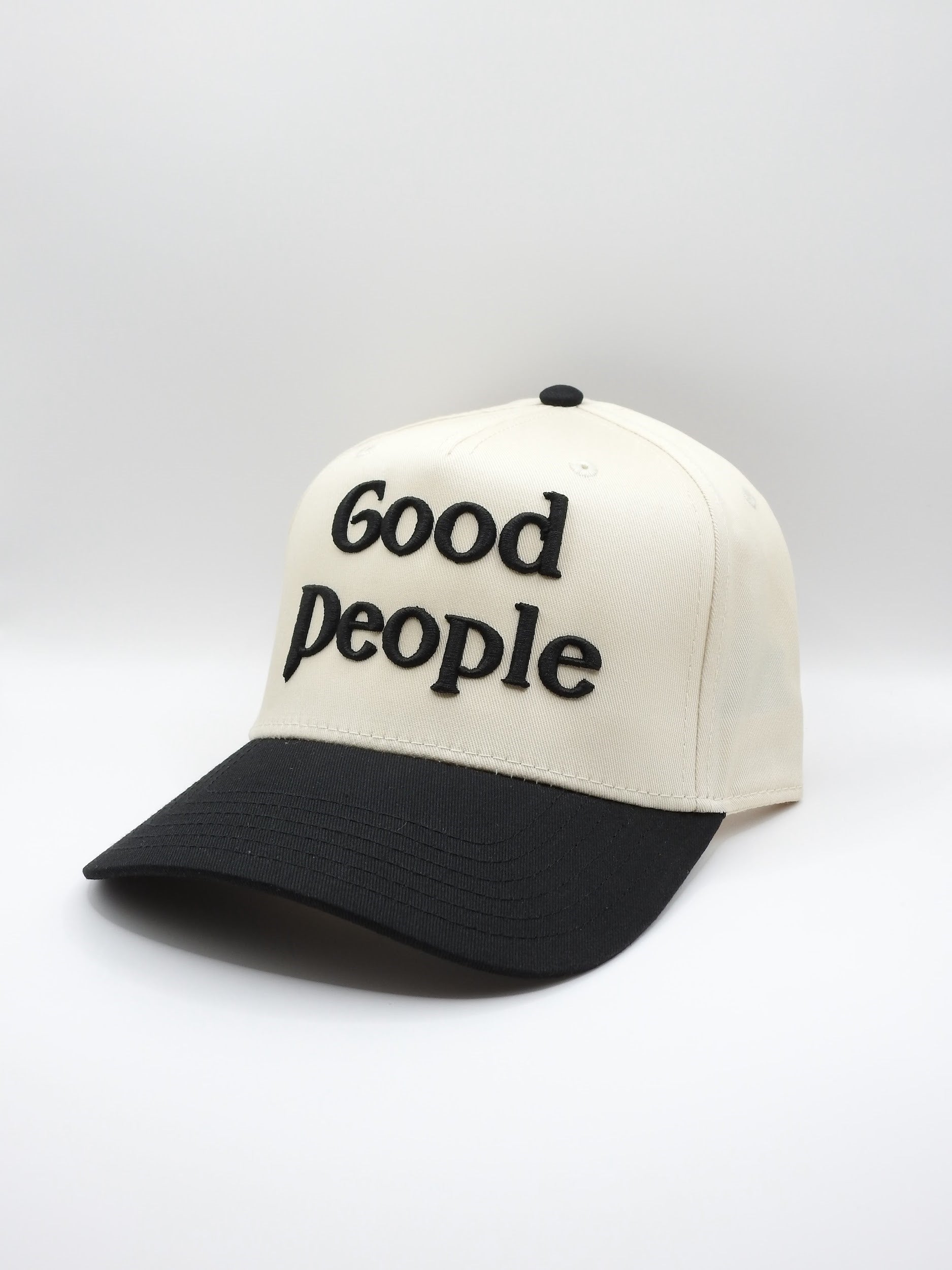 Hat with 'Good people' embroidery on a white background