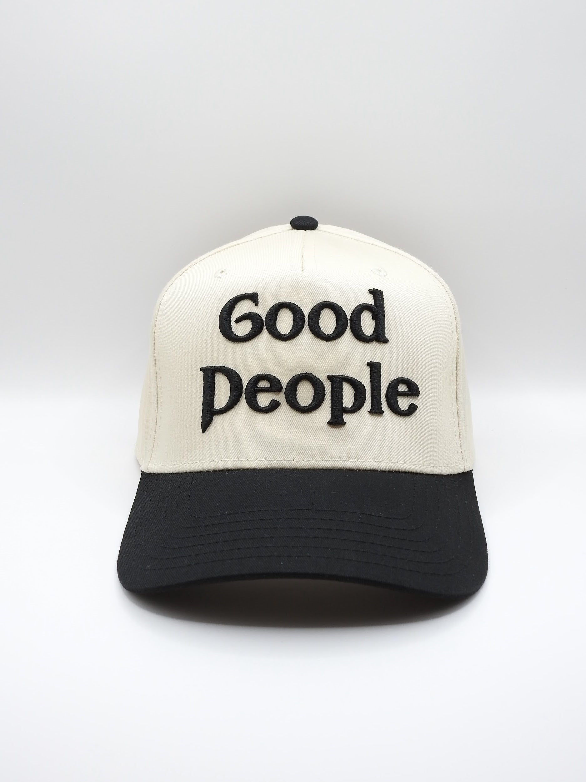 Hat with 'Good People' embroidery on a white background.